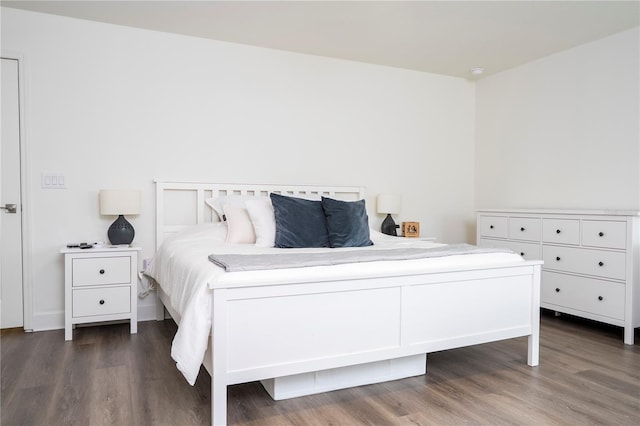 bedroom featuring dark wood-style floors