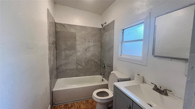 full bath featuring shower / bath combination, a textured wall, toilet, vanity, and wood finished floors