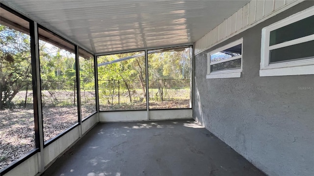 unfurnished sunroom with plenty of natural light