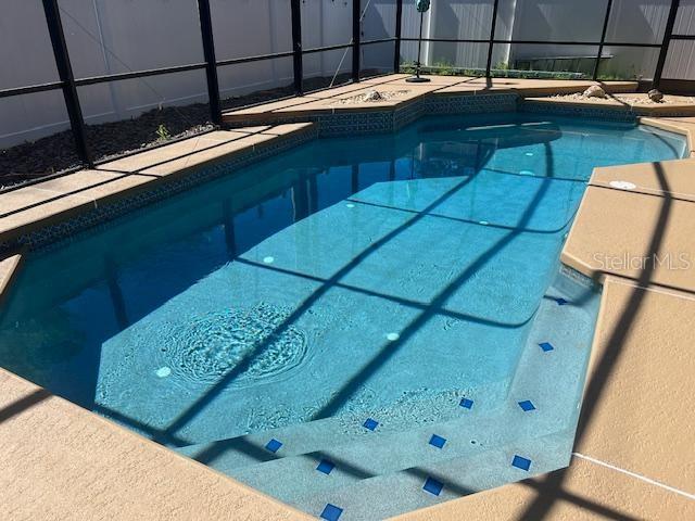 3509 S Saint Lucie Dr, Casselberry, FL 32707 - swimming pool featuring glass enclosure
