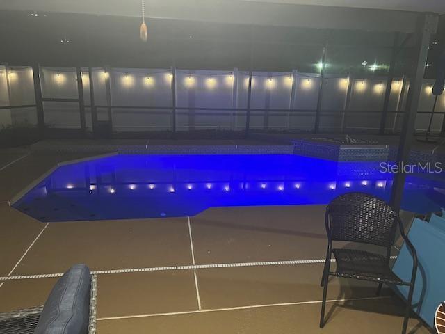 3509 S Saint Lucie Dr, Casselberry, FL 32707 - pool at twilight featuring a patio area