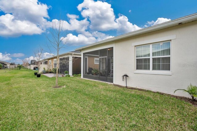 2312 Datura Loop, Saint Cloud, FL 34772 - view of yard featuring a sunroom