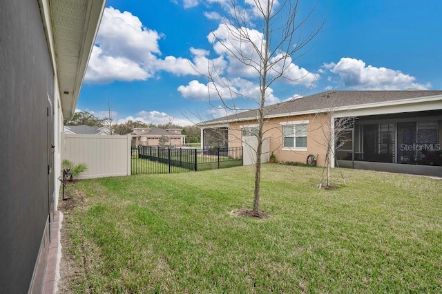 2312 Datura Loop, Saint Cloud, FL 34772 - view of yard with a sunroom and fence