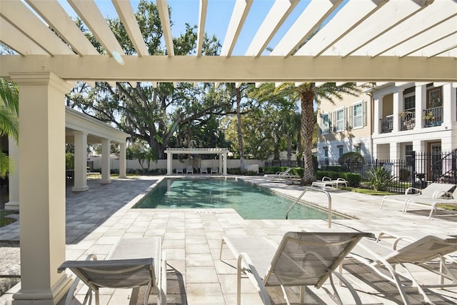 community pool with fence, a pergola, and a patio