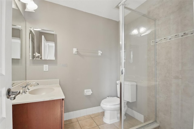 full bath featuring baseboards, toilet, tile patterned floors, vanity, and a shower stall