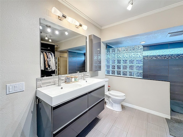 bathroom with toilet, ornamental molding, rail lighting, a textured ceiling, and vanity