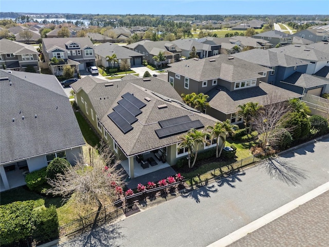 birds eye view of property with a residential view