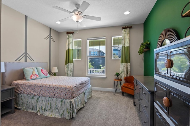 bedroom featuring recessed lighting, light colored carpet, ceiling fan, a textured ceiling, and baseboards