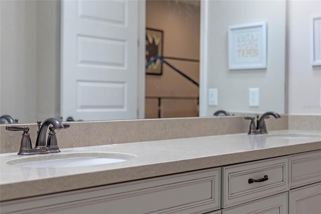 full bathroom featuring double vanity and a sink