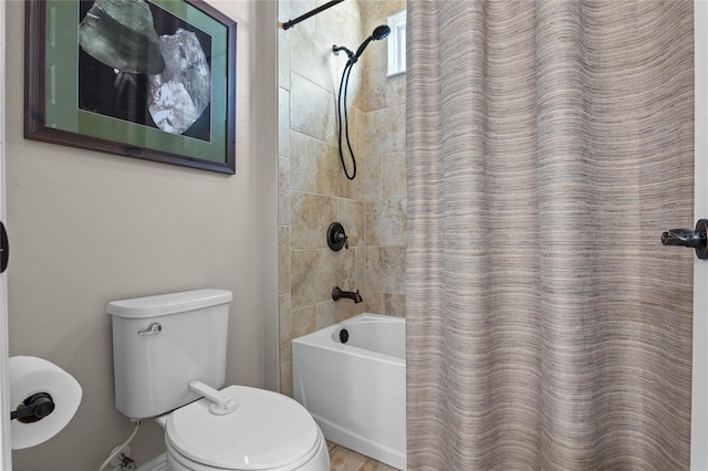 full bath with toilet and shower / bath combo with shower curtain