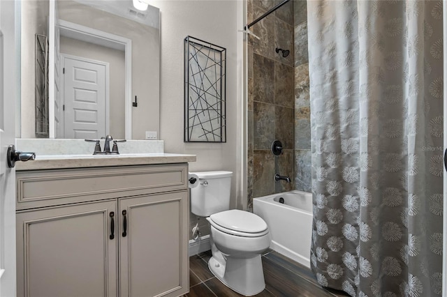 bathroom featuring visible vents, toilet, wood finished floors, shower / bathtub combination with curtain, and vanity