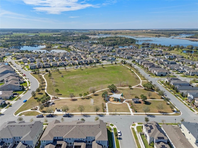 birds eye view of property with a residential view and a water view