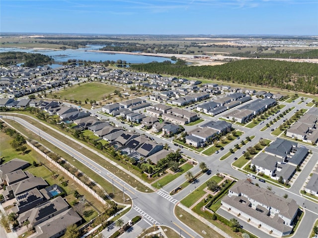 bird's eye view with a residential view and a water view