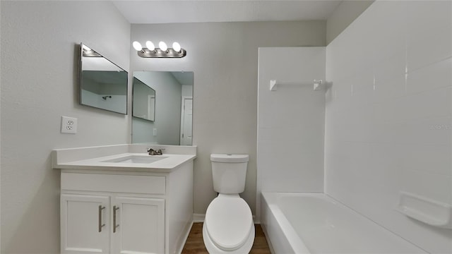 full bathroom with toilet, wood finished floors, and vanity