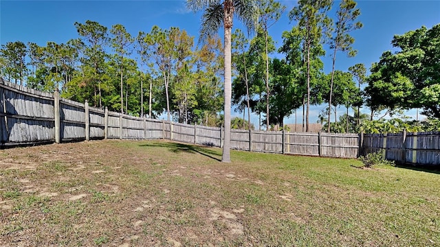 view of yard with a fenced backyard