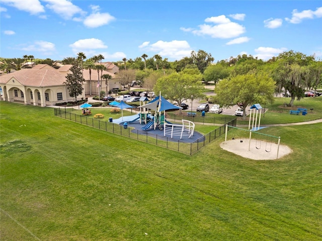 2541 Shoal Bass Way, Kissimmee, FL 34746 - view of property's community with a lawn, playground community, and fence