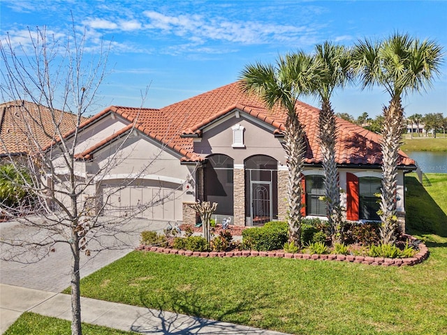 2541 Shoal Bass Way, Kissimmee, FL 34746 - mediterranean / spanish house featuring a tile roof, stucco siding, driveway, a front lawn, and an attached garage
