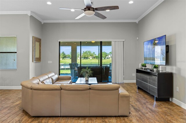 2541 Shoal Bass Way, Kissimmee, FL 34746 - living room featuring ornamental molding, wood-type flooring, recessed lighting, baseboards, and a ceiling fan