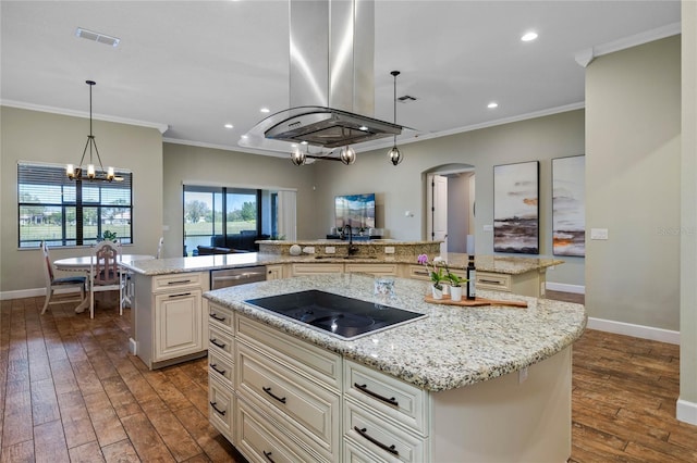 2541 Shoal Bass Way, Kissimmee, FL 34746 - kitchen featuring a spacious island, ornamental molding, island exhaust hood, arched walkways, and black electric stovetop