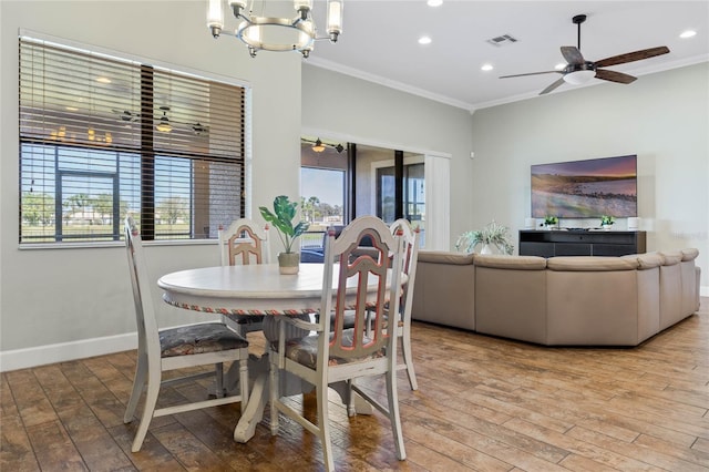 2541 Shoal Bass Way, Kissimmee, FL 34746 - dining area featuring a wealth of natural light, ornamental molding, and hardwood / wood-style floors