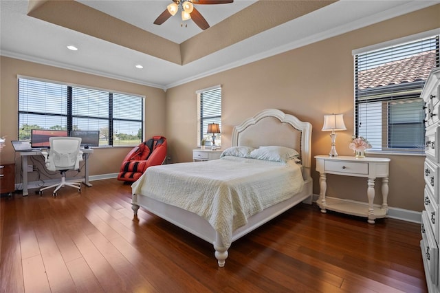 2541 Shoal Bass Way, Kissimmee, FL 34746 - bedroom featuring baseboards, a raised ceiling, crown molding, and dark wood-type flooring
