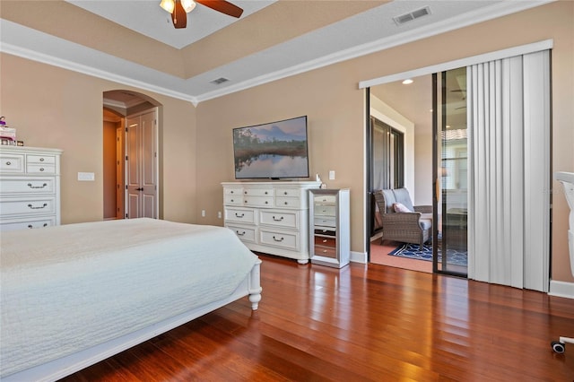 2541 Shoal Bass Way, Kissimmee, FL 34746 - bedroom with wood finished floors, ornamental molding, visible vents, arched walkways, and a ceiling fan