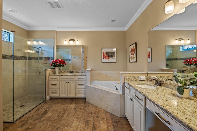 2541 Shoal Bass Way, Kissimmee, FL 34746 - full bathroom with visible vents, a shower stall, hardwood / wood-style floors, and a sink