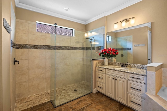 2541 Shoal Bass Way, Kissimmee, FL 34746 - bathroom featuring crown molding, walk in shower, vanity, wood finished floors, and a tub to relax in