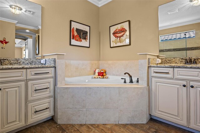 2541 Shoal Bass Way, Kissimmee, FL 34746 - full bathroom featuring ornamental molding, a garden tub, vanity, and visible vents