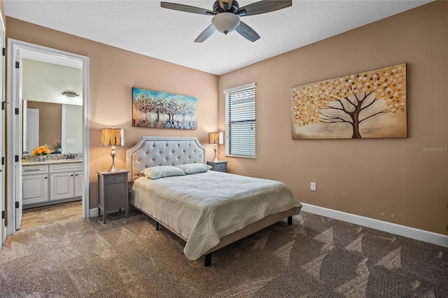 2541 Shoal Bass Way, Kissimmee, FL 34746 - bedroom with light colored carpet, baseboards, connected bathroom, and a ceiling fan