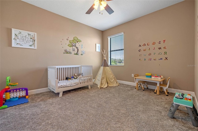 2541 Shoal Bass Way, Kissimmee, FL 34746 - carpeted bedroom with a nursery area, baseboards, and ceiling fan
