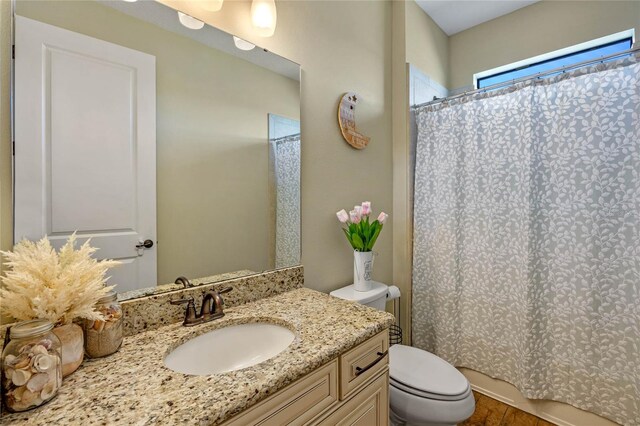 2541 Shoal Bass Way, Kissimmee, FL 34746 - bathroom featuring vanity, toilet, and wood finished floors