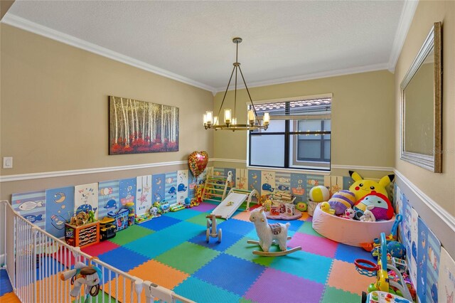 2541 Shoal Bass Way, Kissimmee, FL 34746 - rec room with a chandelier and crown molding