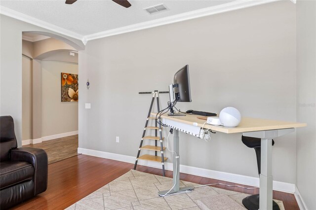 2541 Shoal Bass Way, Kissimmee, FL 34746 - office space with wood finished floors, ornamental molding, baseboards, a ceiling fan, and arched walkways