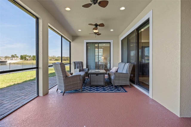 2541 Shoal Bass Way, Kissimmee, FL 34746 - sunroom with a ceiling fan, a water view, an outdoor living space, and recessed lighting