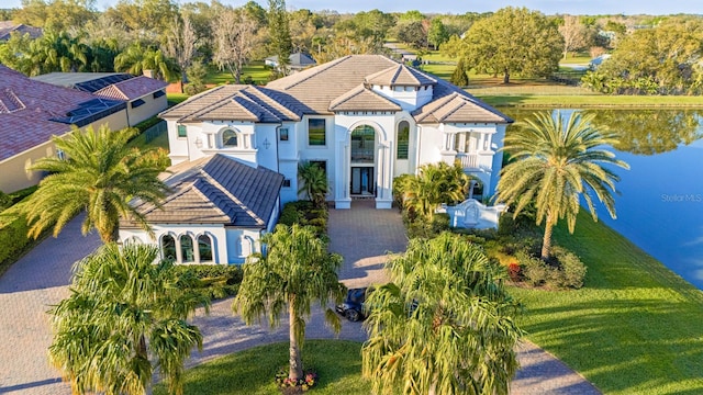 birds eye view of property with a water view