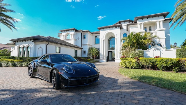 mediterranean / spanish-style house with stucco siding