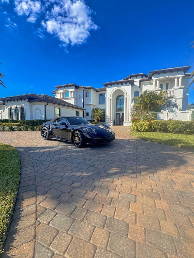 view of front of property with decorative driveway