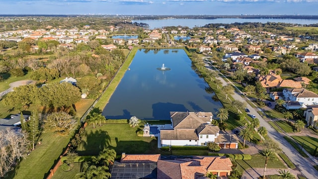 birds eye view of property with a residential view and a water view