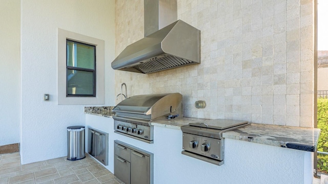 view of patio / terrace with exterior kitchen and area for grilling