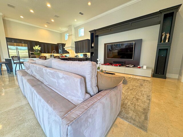 living room featuring visible vents, crown molding, and recessed lighting