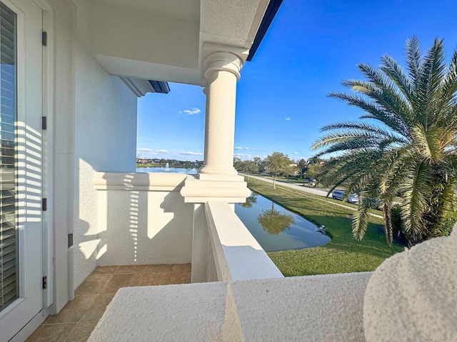 balcony featuring a water view