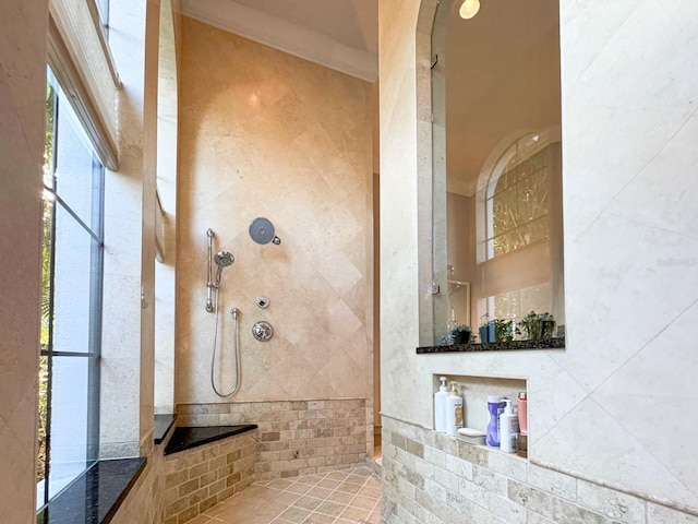 bathroom with a tile shower