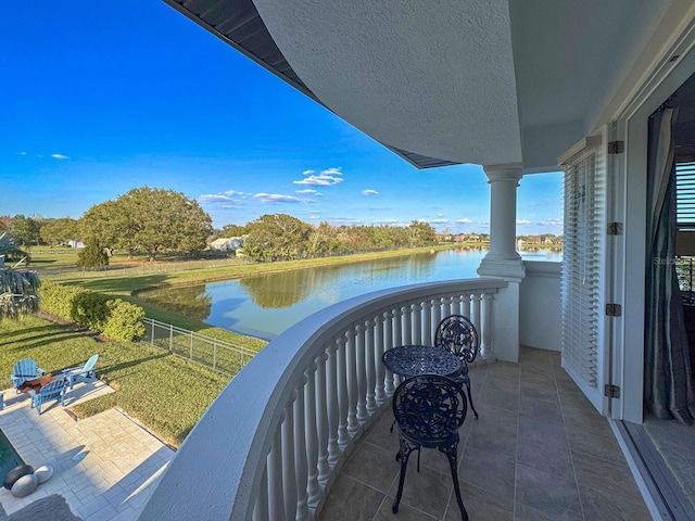 balcony featuring a water view