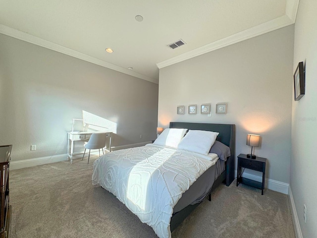 carpeted bedroom with visible vents, crown molding, and baseboards