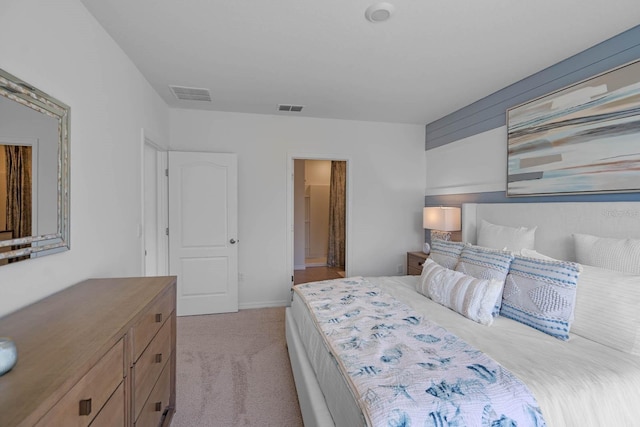 unfurnished bedroom featuring light carpet and visible vents