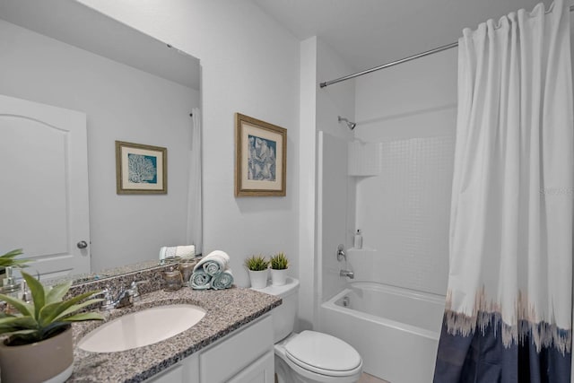 full bathroom featuring toilet, shower / tub combo with curtain, and vanity