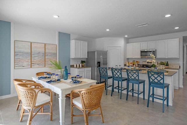 dining space with visible vents and recessed lighting