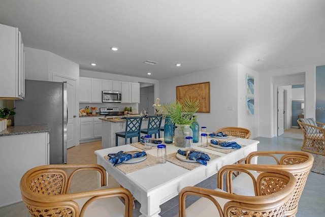 dining area featuring visible vents and recessed lighting