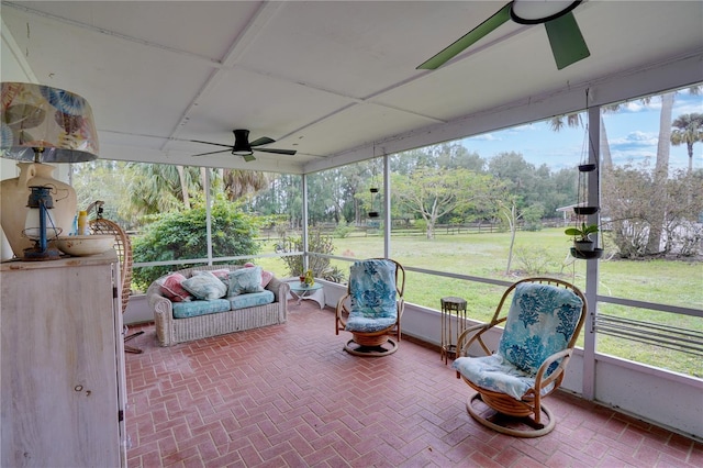 sunroom / solarium with ceiling fan